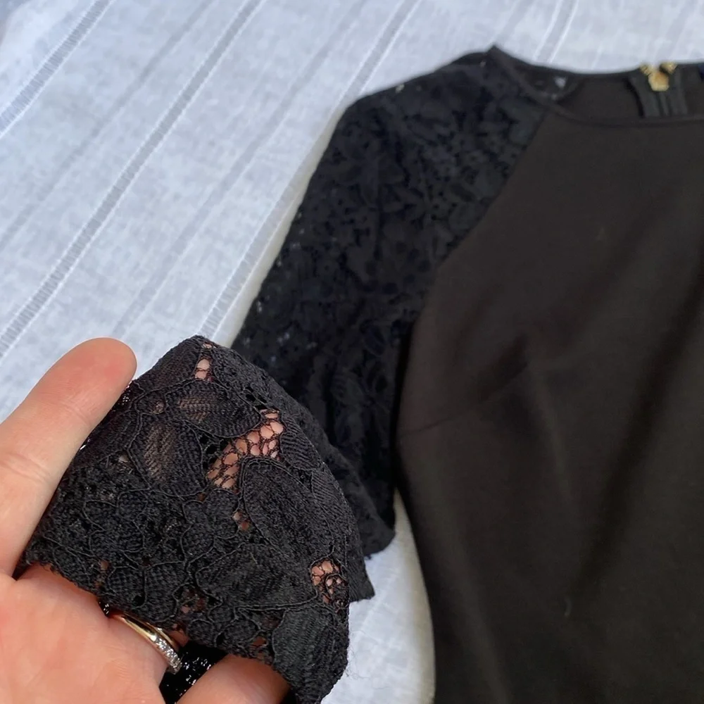 Tommy Hilfiger little black dress with long sleeves lace sleeves.